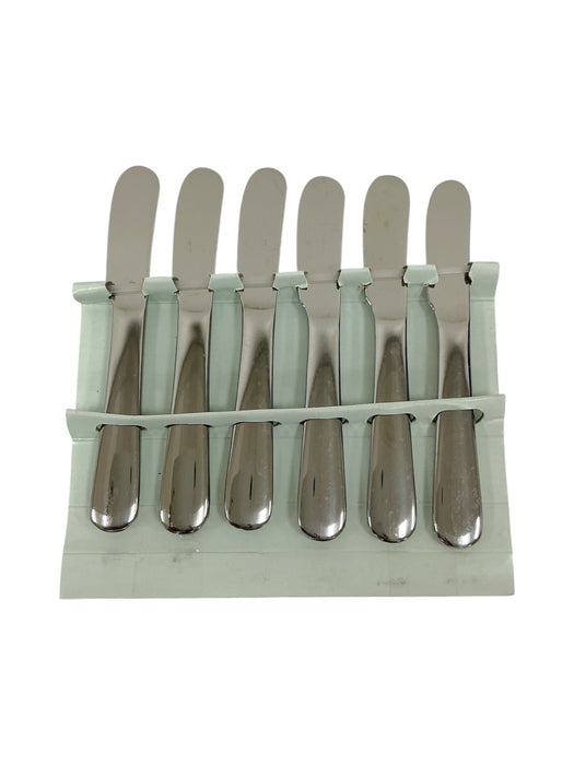 Set 6 cuchillos mantequilleros - vista frontal en soporte plástico blanco con hojas hacia arriba
