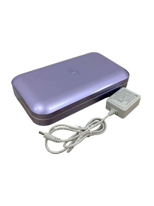 Esterilizador UV PhoneSoap - dispositivo lila cerrado con adaptador de corriente blanco